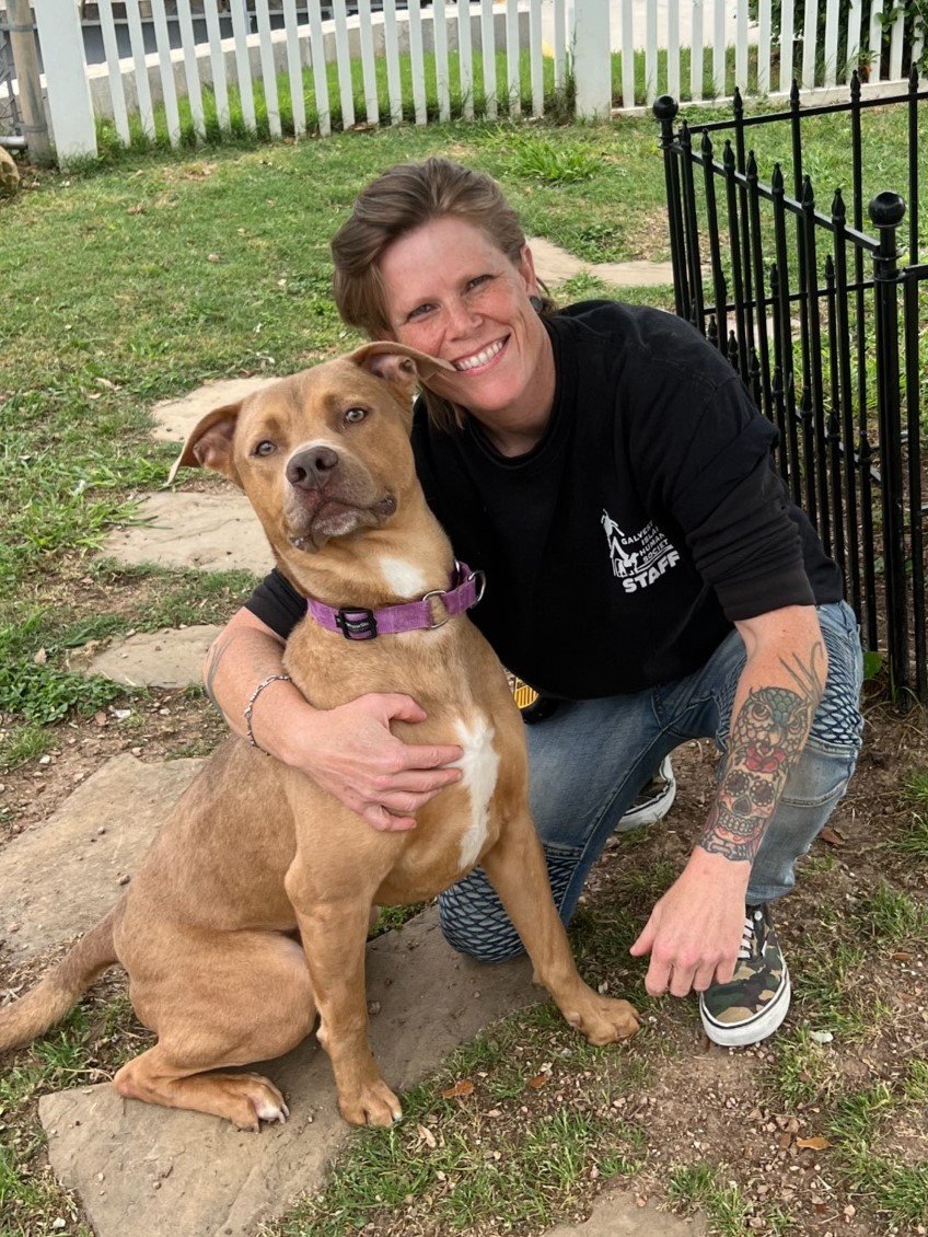 Photo of Megan Plasek volunteer with dog