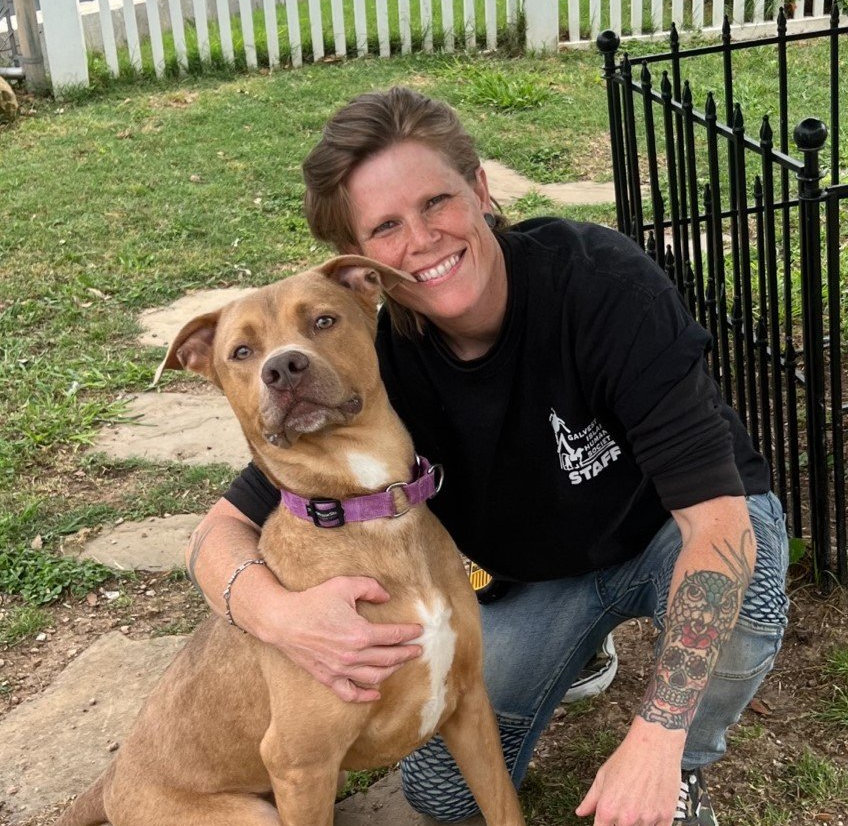 Photo of Megan Plasek volunteer with dog